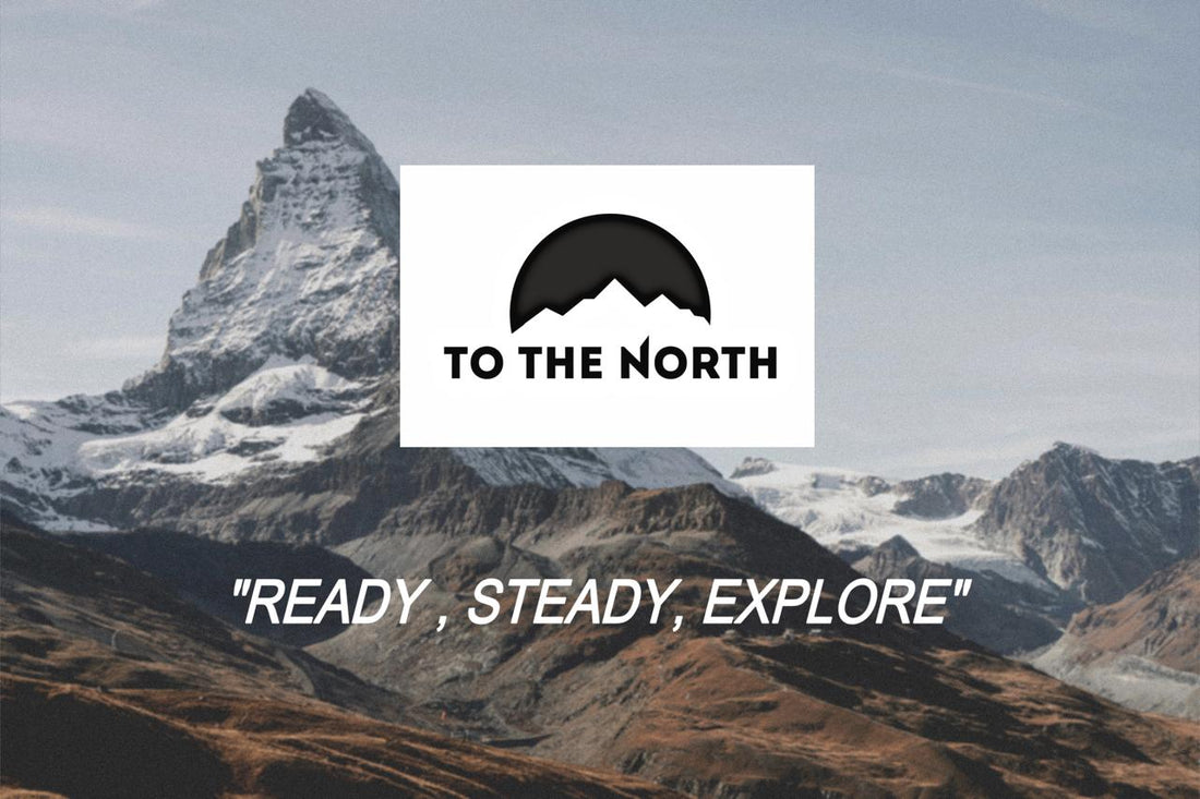 a mountain and brand logo TO THE NORTH  with tag line , READY STEADY EXPLORE